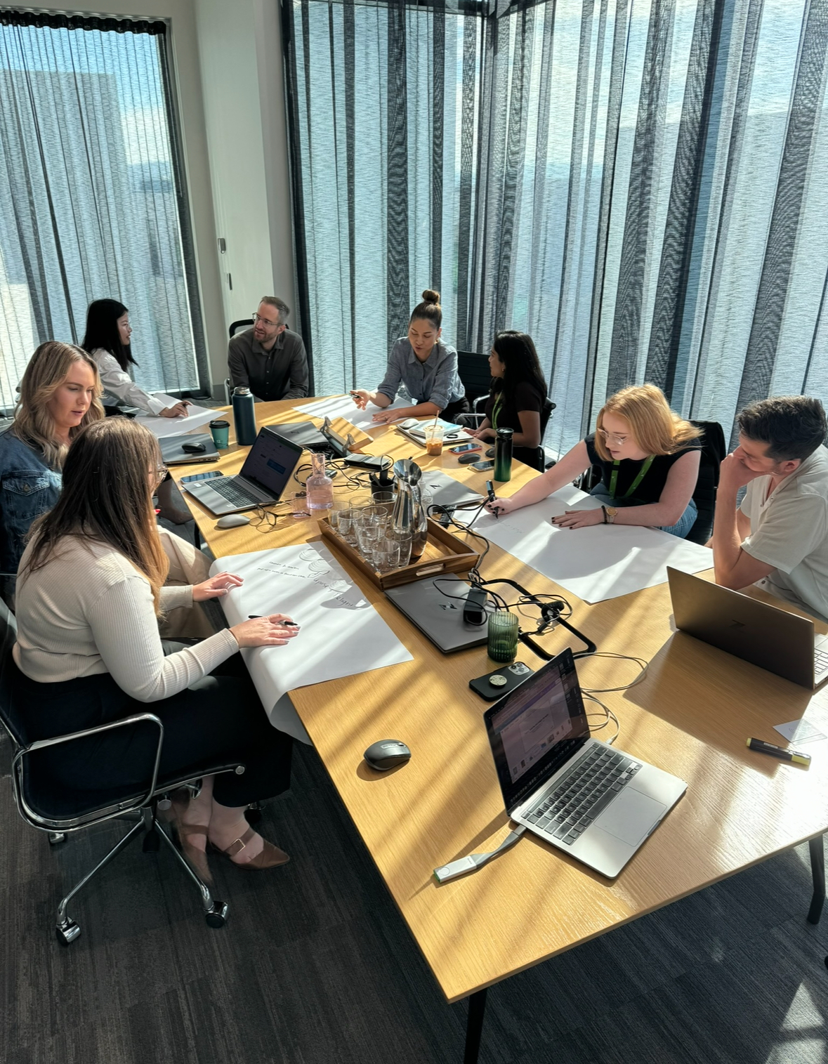 Marketing managers and the creative team working together in a facilitated session